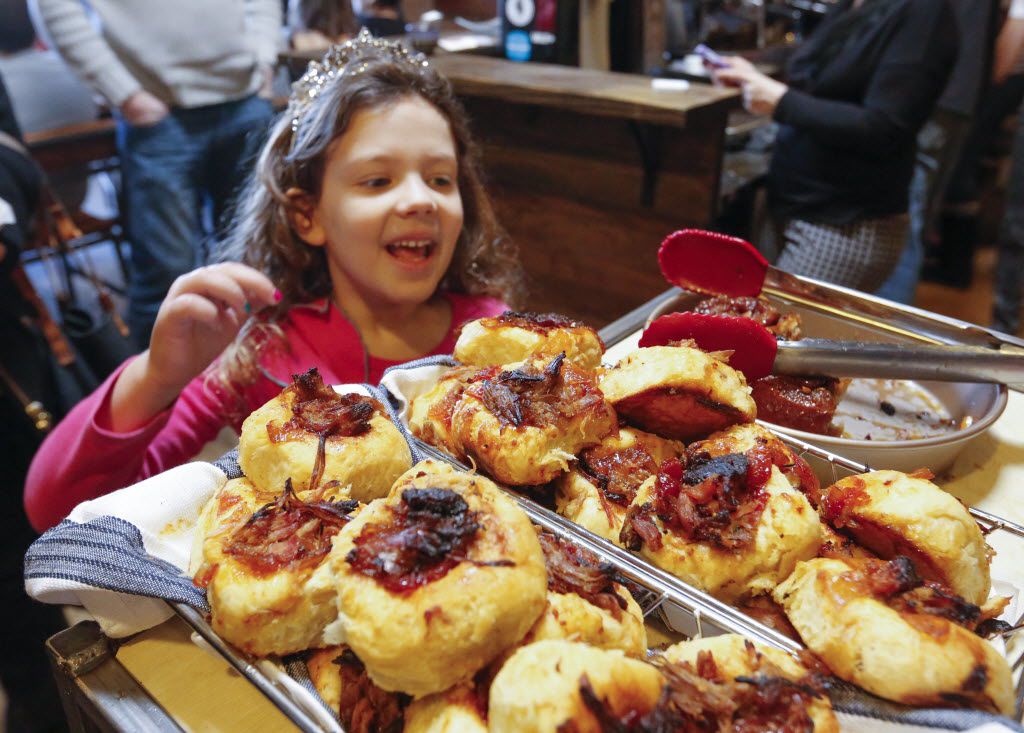 Ella McCallister, 6, picks out fresh pastry during a visit to Full City Rooster.