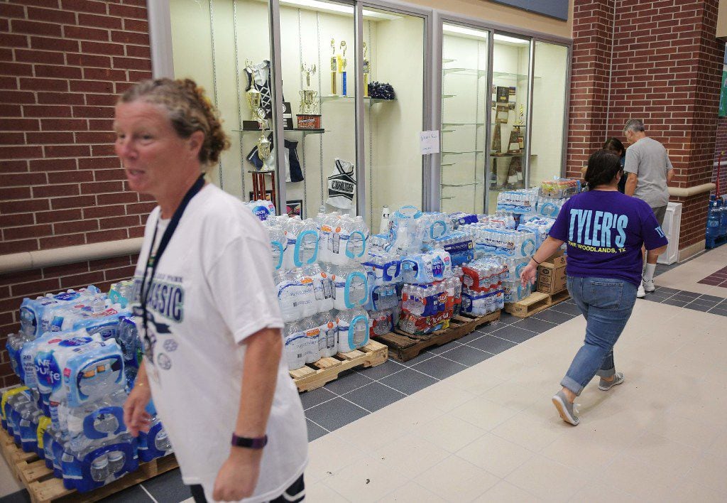 Cases of drinking water are seen in College Park High School which was set up as a temporary...