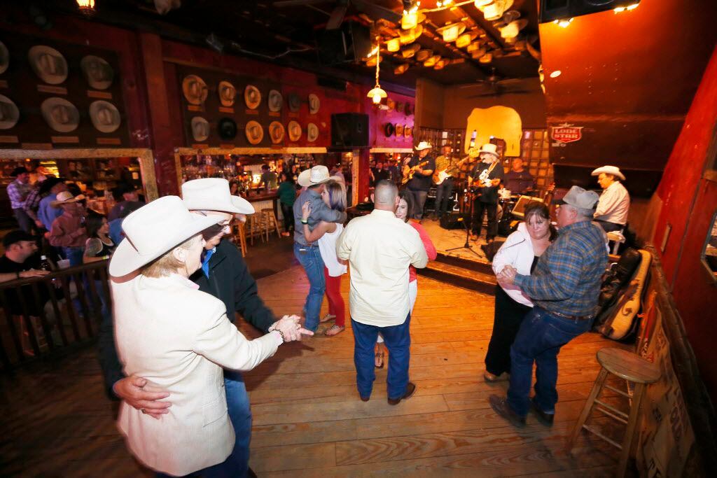Patrons of the White Elephant Saloon dance to the live country music of Tommy Alverson.