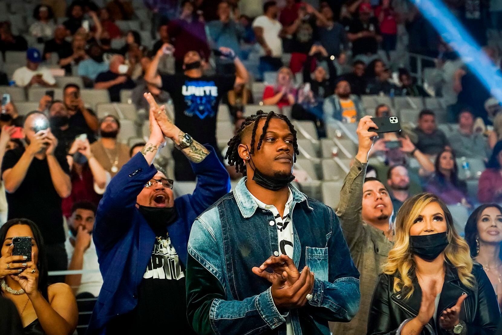 Dallas Cowboys defensive end Randy Gregory joins in the crowd applause as Vergil Ortiz Jr. takes the ring to fight Maurice Hooker for the vacant WBO international welterweight title at Dickies Arena on Saturday, March 20, 2021, in Fort Worth.