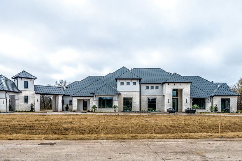 Located within the Lovejoy ISD, this contemporary design has five bedrooms, a glass-enclosed...