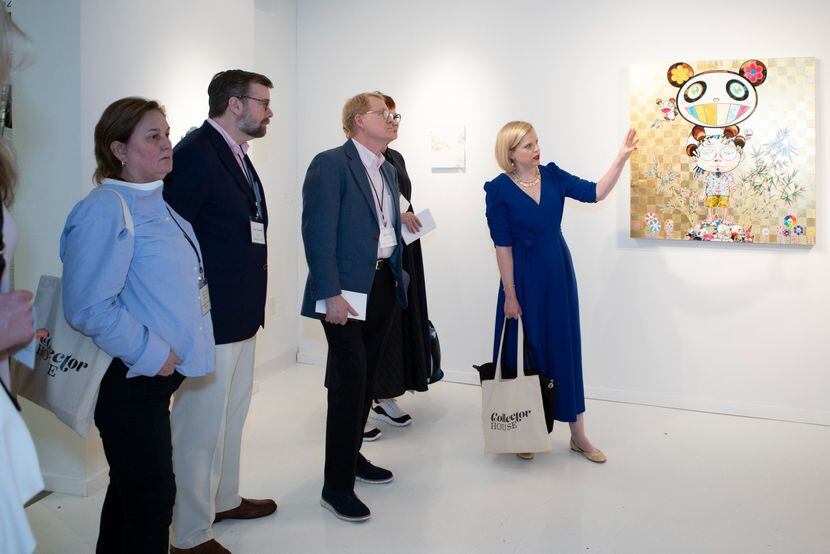 Art advisor Jennifer Klos talks art with a group of enthusiasts.