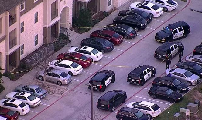 Police crime tape surrounds several cars in an apartment complex in Denton where an officer-involved shooting occurred Tuesday morning.