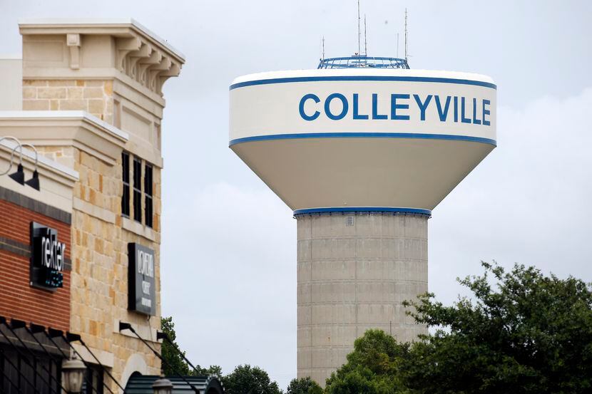 A Colleyville water tower is pictured near a shopping center in Colleyville, Texas, Tuesday,...