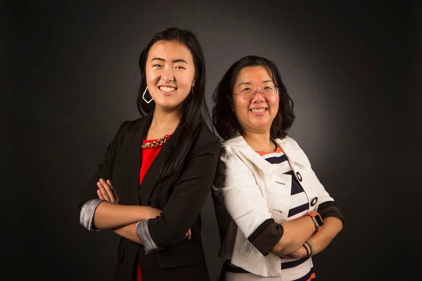 Alice Hou, founder of Girls in STEM, left, and her mom, Sara He, pose for a photograph at...