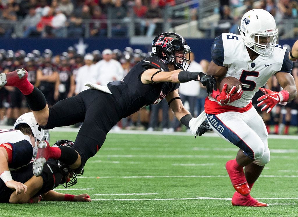Allen running back Brock Sturges (5) gets past Lake Travis defensive back Ty Badciong (3) on a 13-yard touchdown run during the first half of the Class 6A Division I state championship game at AT&T Stadium on Saturday, Dec. 23, 2017, in Arlington, Texas. (Smiley N. Pool/The Dallas Morning News)
