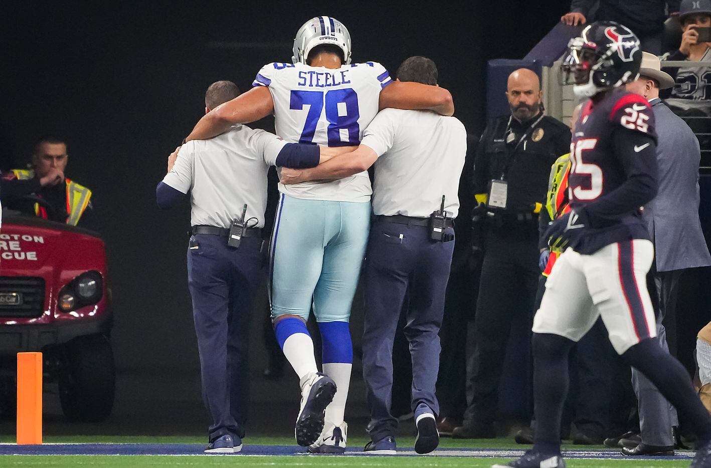Dallas Cowboys offensive tackle Terence Steele (78) is helped off the field after being...