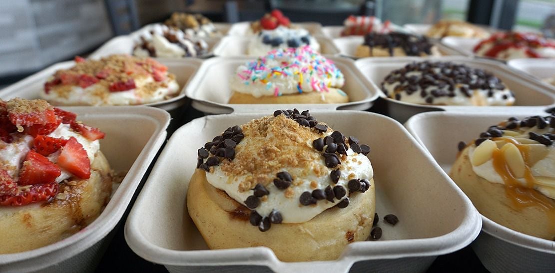 Rows of cinnamon rolls await hungry customers at a Cinnaholic location. The company plans to...