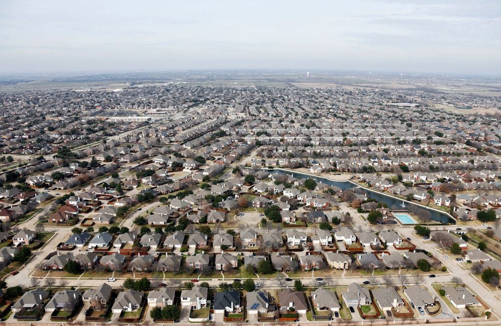 This aerial view of homes in Frisco was taken in February. Texas gained about 4.5 million...