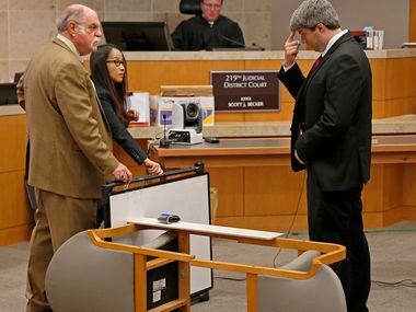 Defendant Jason Lowe (right) points to his forehead to indicate location of Jessie...