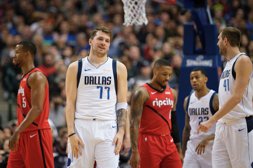 Mavericks forward Luka Doncic reacts after being fouled during the first half of a game...