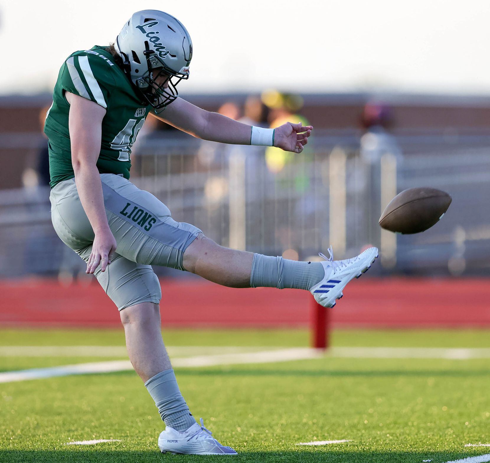 Frisco Reedy punter Jackson Naber attempts a punt against Frisco Lone Star during the first...