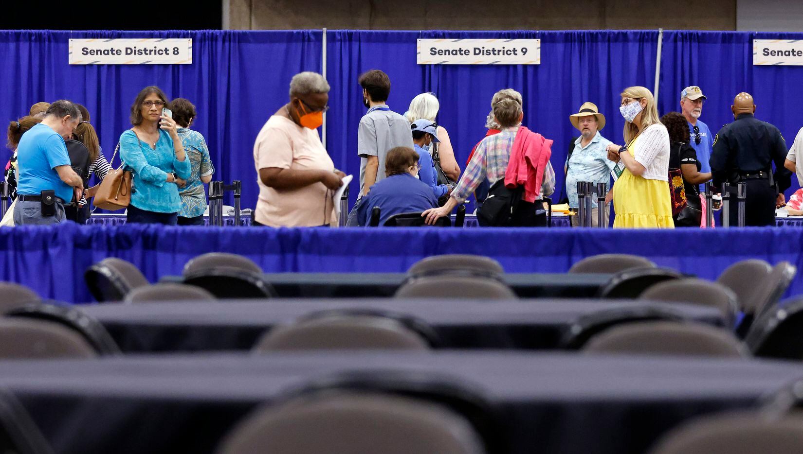 Delegates pick up their credentials during the opening day of the 2022 Texas Democratic...