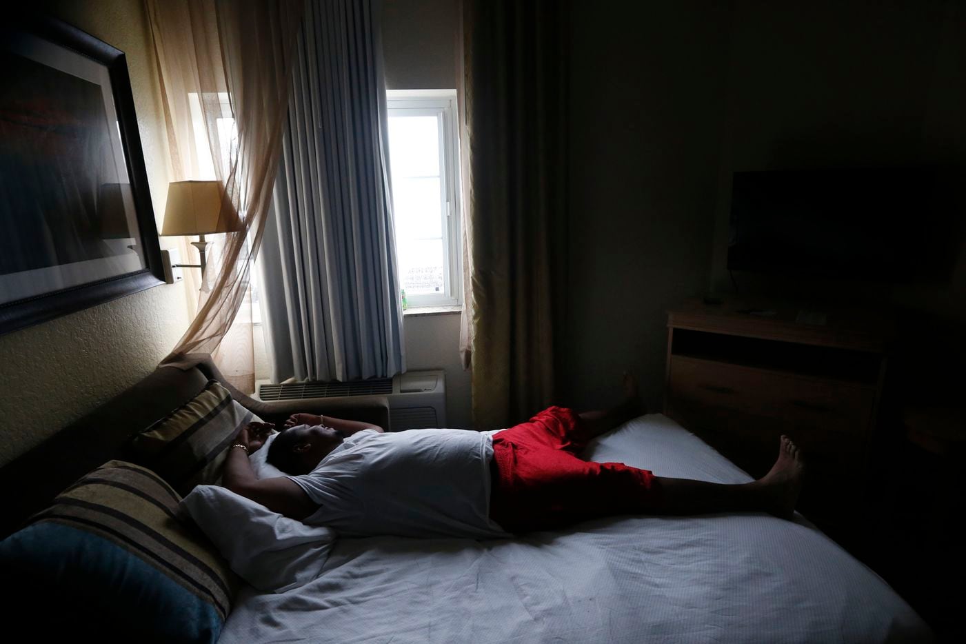 Arthur Shine, of Key West, Fla., watches from his hotel window as Hurricane Irma hits in...