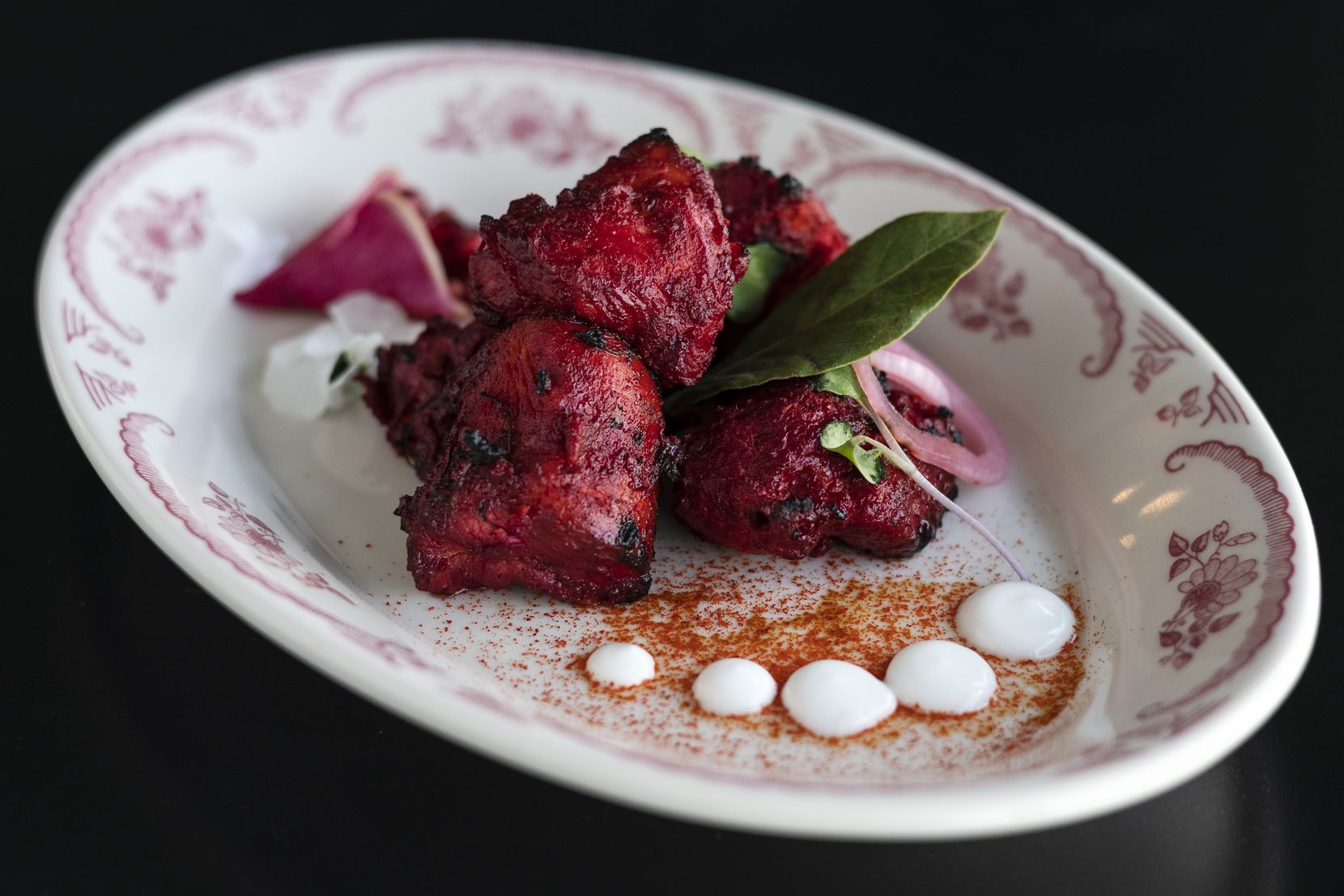 Anali chicken with pomegranate seeds, yogurt, ginger, chili and fenugreek. From Bishop Arts' finest Indian restaurant.