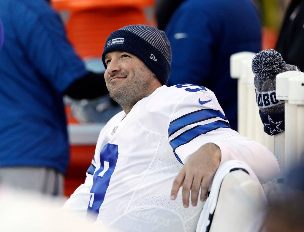 FILE - In this Jan. 1, 2017, file photo, Dallas Cowboys' Tony Romo smiles on the bench...