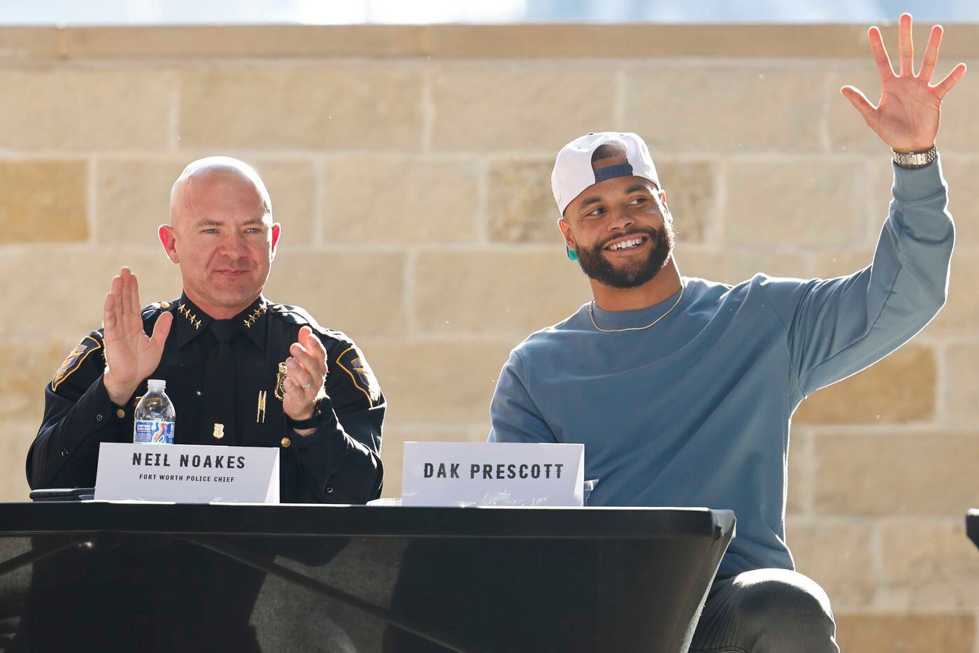 Fort Worth Police Chief Chief Noakes, left, applauds as  founder of Faith Fight Finish and...