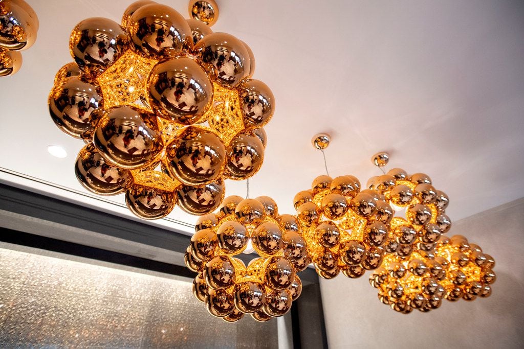 Modern light fixtures hang above the bar of the Flagship First Dining area in the new...