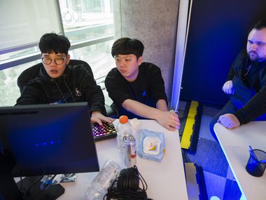 Dallas Fuel Assitant Coach Kim "Yong" Yong-Jin (left), Assistant Coach Dang "Vol'Jin" Min-Gyu, and Head Coach Aaron "Aero" Atkins (right) practice on Wednesday, January 29, 2020 at Envy Gaming headquarters in Dallas. (Ashley Landis/The Dallas Morning News)
