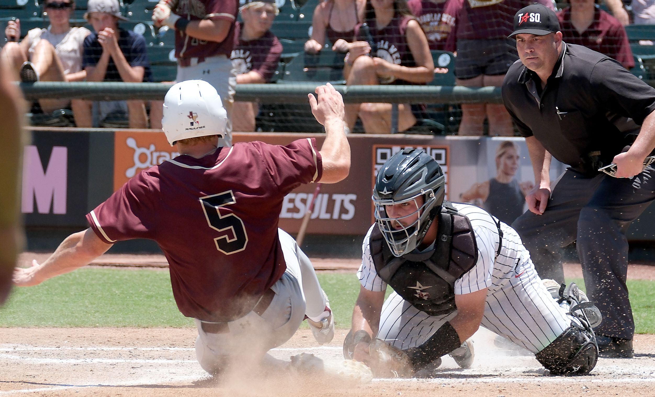 Argyle Hunter Sandifer, (8), tags out Magnolia West Jackson Blank, (5), at home plate during...