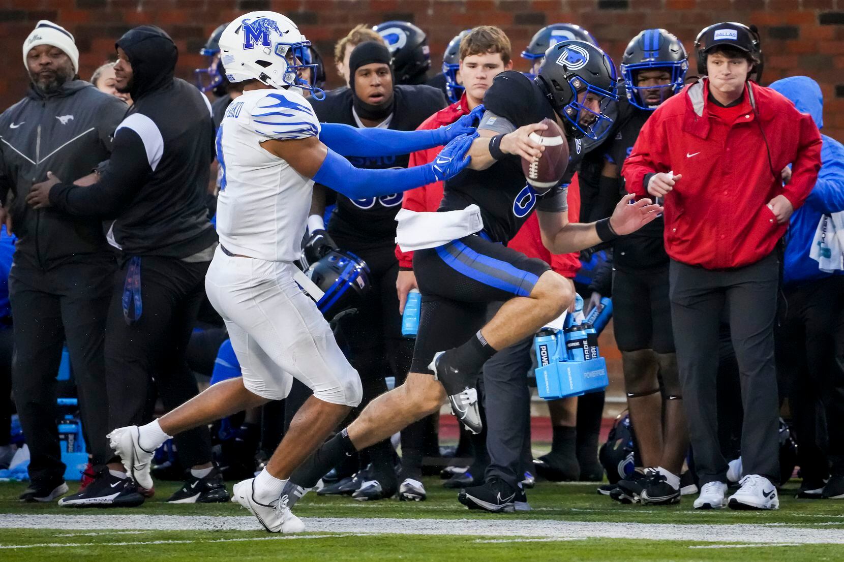 SMU quarterback Tanner Mordecai (8) is pushed out of bounds by Memphis linebacker Geoffrey...