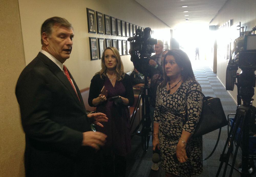 Mayor Mike Rawlingsn (left) met with reporters, including Fox4's Lori Brown (center) and...