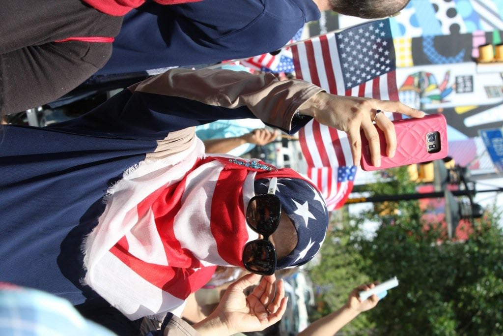 Fouzia Al-Amoodi, of Irving, Texas, takes a picture during the Dallas Mega March on Sunday, April 9, 2017 on Ross Ave in downtown Dallas.
