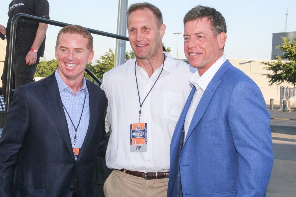 Dallas Cowboys head coach Jason Garrett with former Dallas Cowboys players Chad Hennings and...