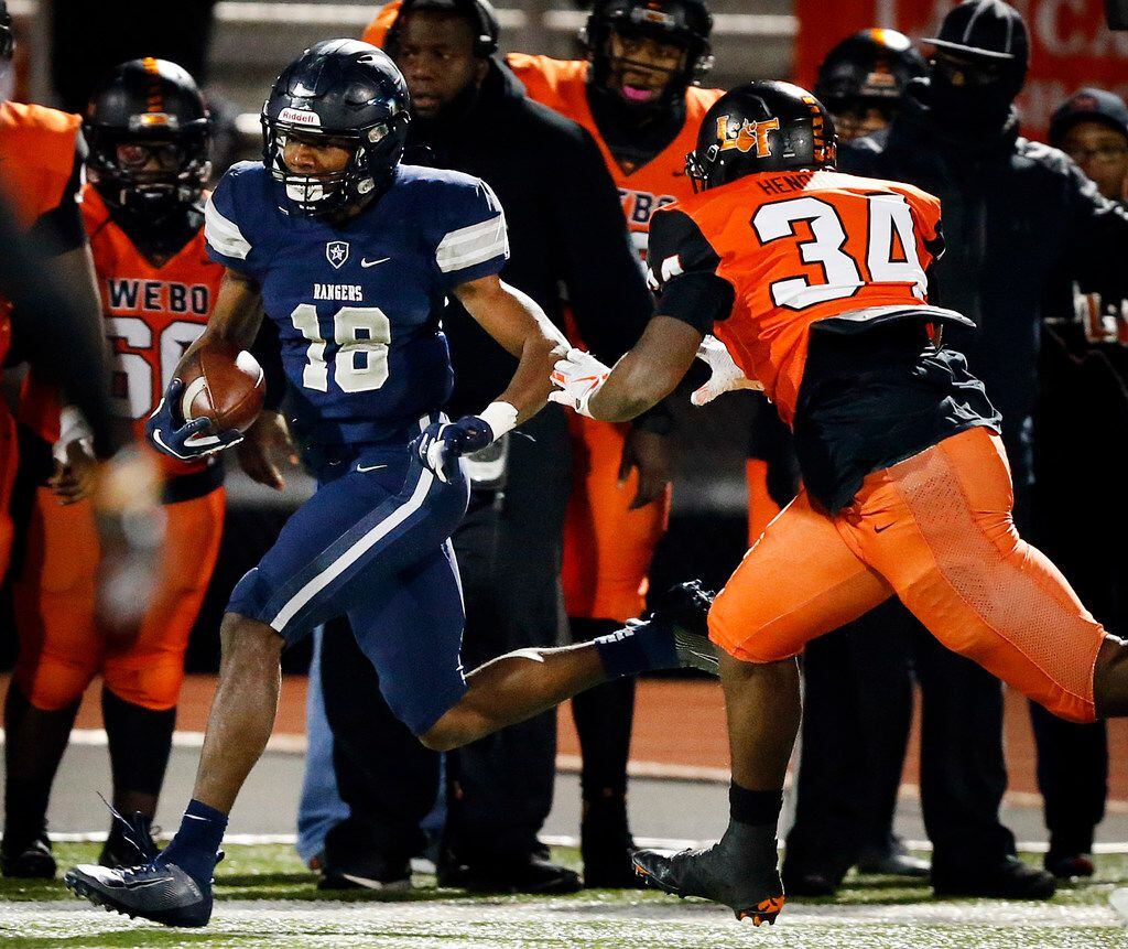 Frisco Lone Star wide receiver Marvin Mims (18) races down the sideline after a third quarter pass completion against Lancaster Montrell Hendricks (34) during their Class 5A Division I Regional championship at Wilkerson-Sanders Stadium in Rockwall, Texas, Friday, December 6, 2019. (Tom Fox/The Dallas Morning News)