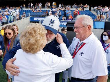 Cowboys head coach Mike McCarthy gives his mother Ellen McCarthy a kiss before their first...