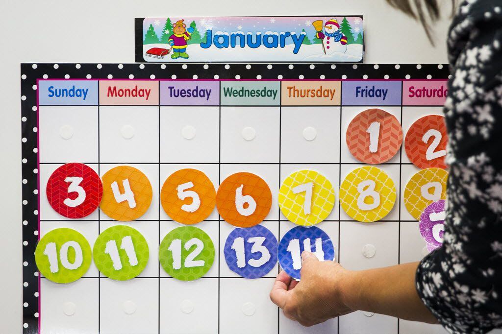  Teacher Linda Collins reset her classroom calendar as Richardson ISD's Northlake Elementary...
