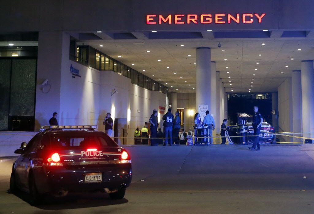 Law enforcement officers stood outside the emergency room at Baylor University Medical...