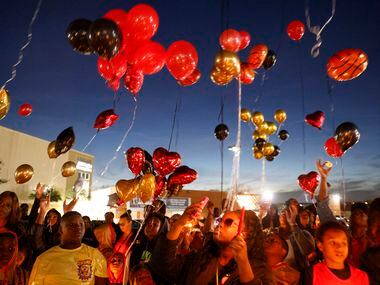 People release balloons in memory of 11-year-old De’Evan McFall outside Trinity Basin...