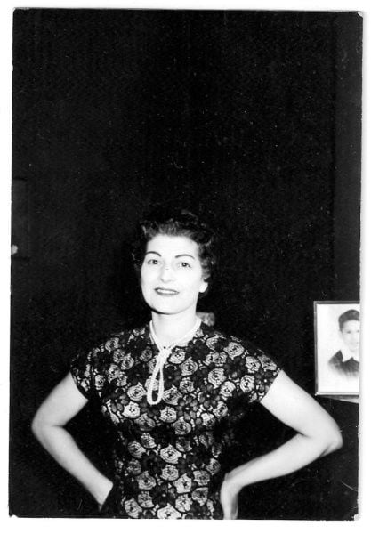 Betty was dressed to the nines when she sang with bands in West Virginia and Ohio, even though money was tight. A photo of her oldest son, Crys, can be seen behind her in this late 1950s photo taken at home.