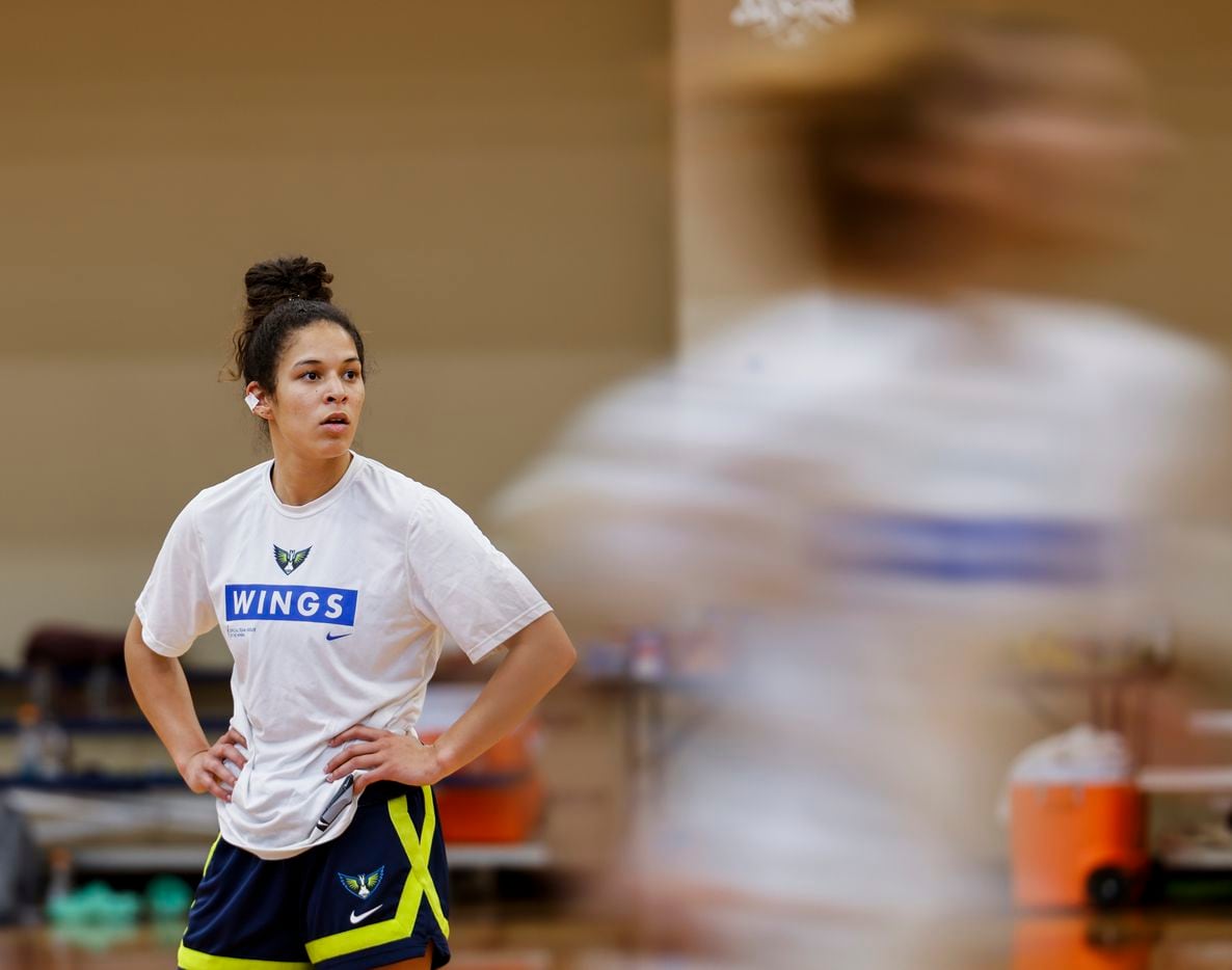 Dallas Wings first draft pick Veronica Burton watches the play during a practice at training camp...
