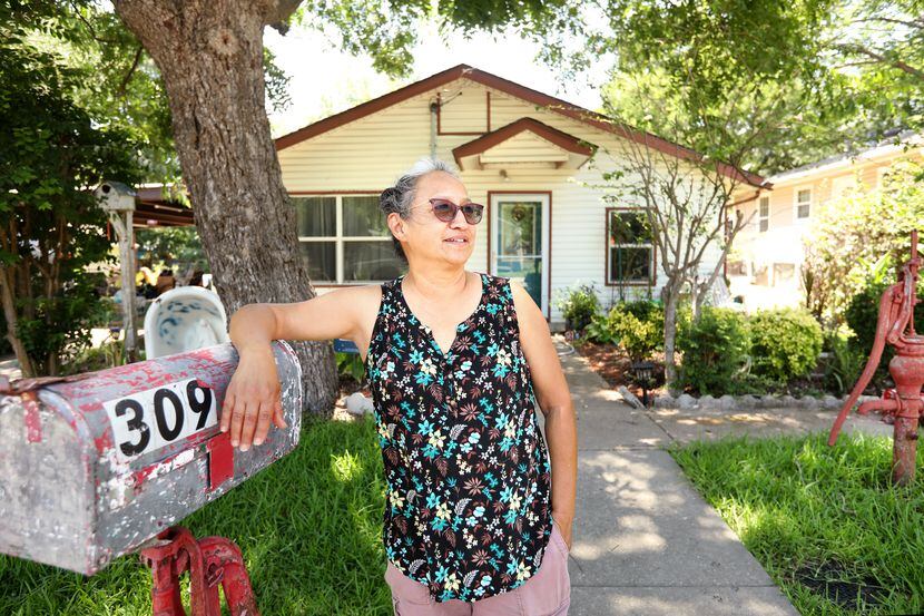 Silvia Escamilla poses for a photograph at her home in the La Loma neighborhood of McKinney...
