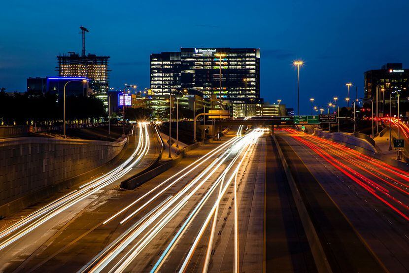 A long exposure shows traffic on the Dallas North Tollway at Tennyson Parkway in Plano.  