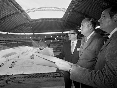 Dallas Cowboys owner Clint Murchinson, left, general manager Tex Schramm, center and Irving...