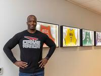 Former NBA player Jermaine O'Neal poses with several of his former team jerseys at Drive...