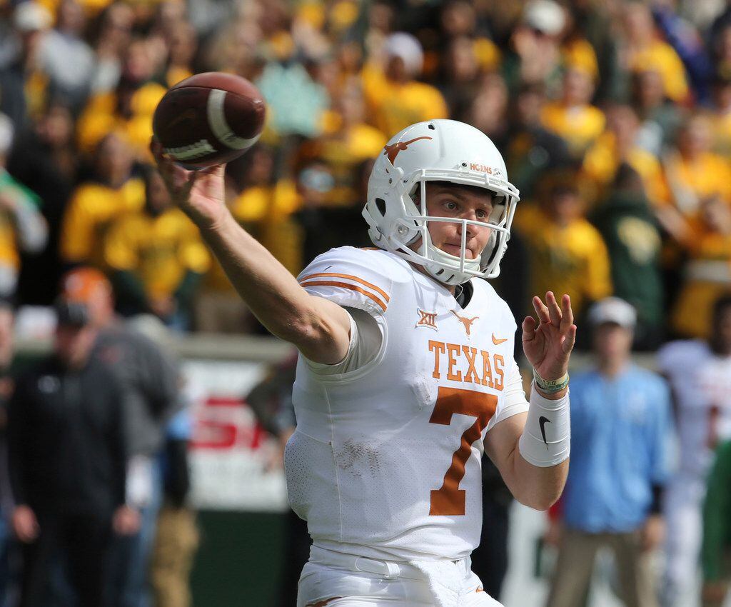 Texas quarterback Shane Buechele throws downfield against Baylor in the second half of an...
