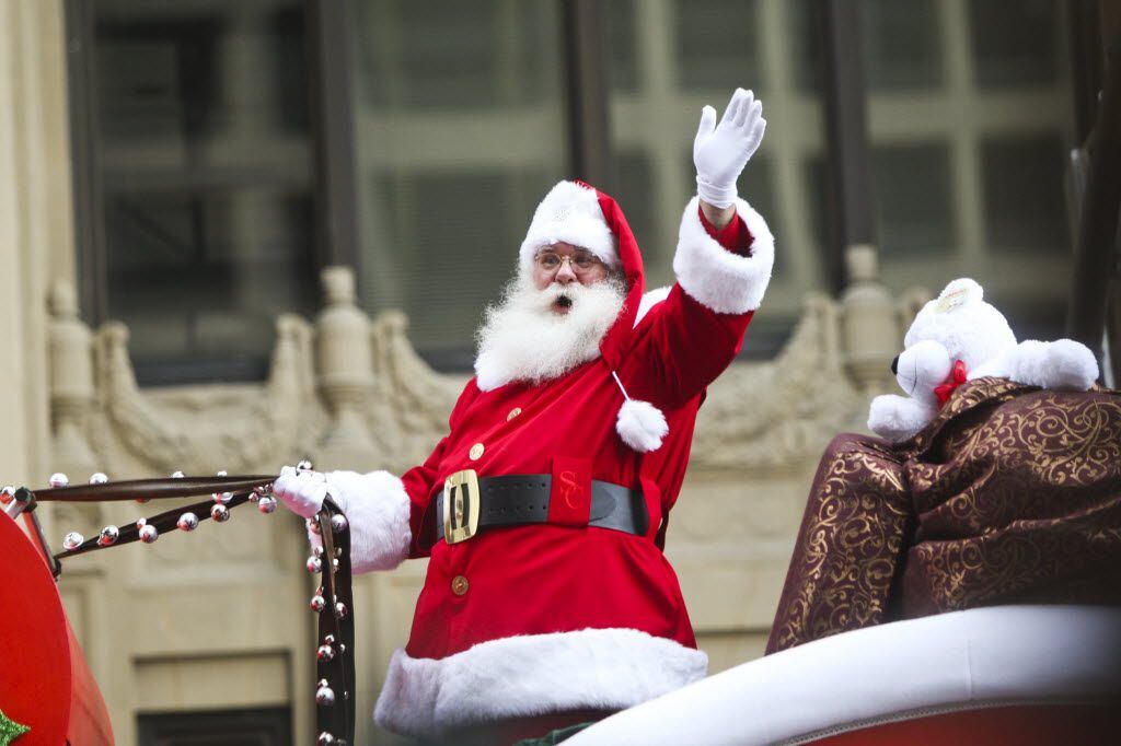 Santa Claus greets spectators during the 25th annual Children's Medical Center Holiday...