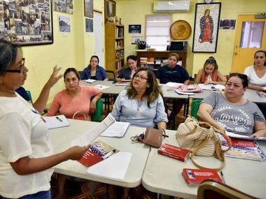 Instructor Jacinta Hernandez, left, conducts a lesson during a citizenship class at Casa...