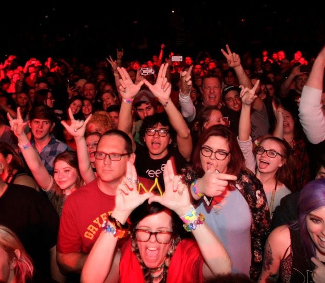Fans cheer as Weezer performs.