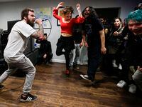 Sub-Primal singer Travis Herrin performs as people mosh during a house show on Friday, March...