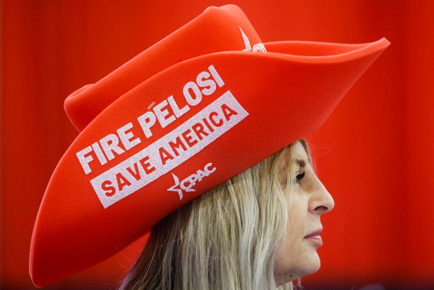 Volunteer Teresa Winata wears a hat reading “Fire Pelosi Save America” during the second day...