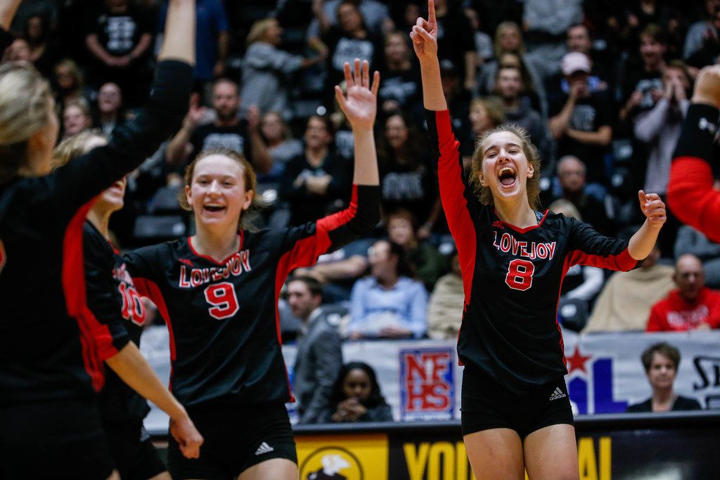 The Lovejoy Leopards celebrate after scoring in the third set of a class 5A volleyball state...