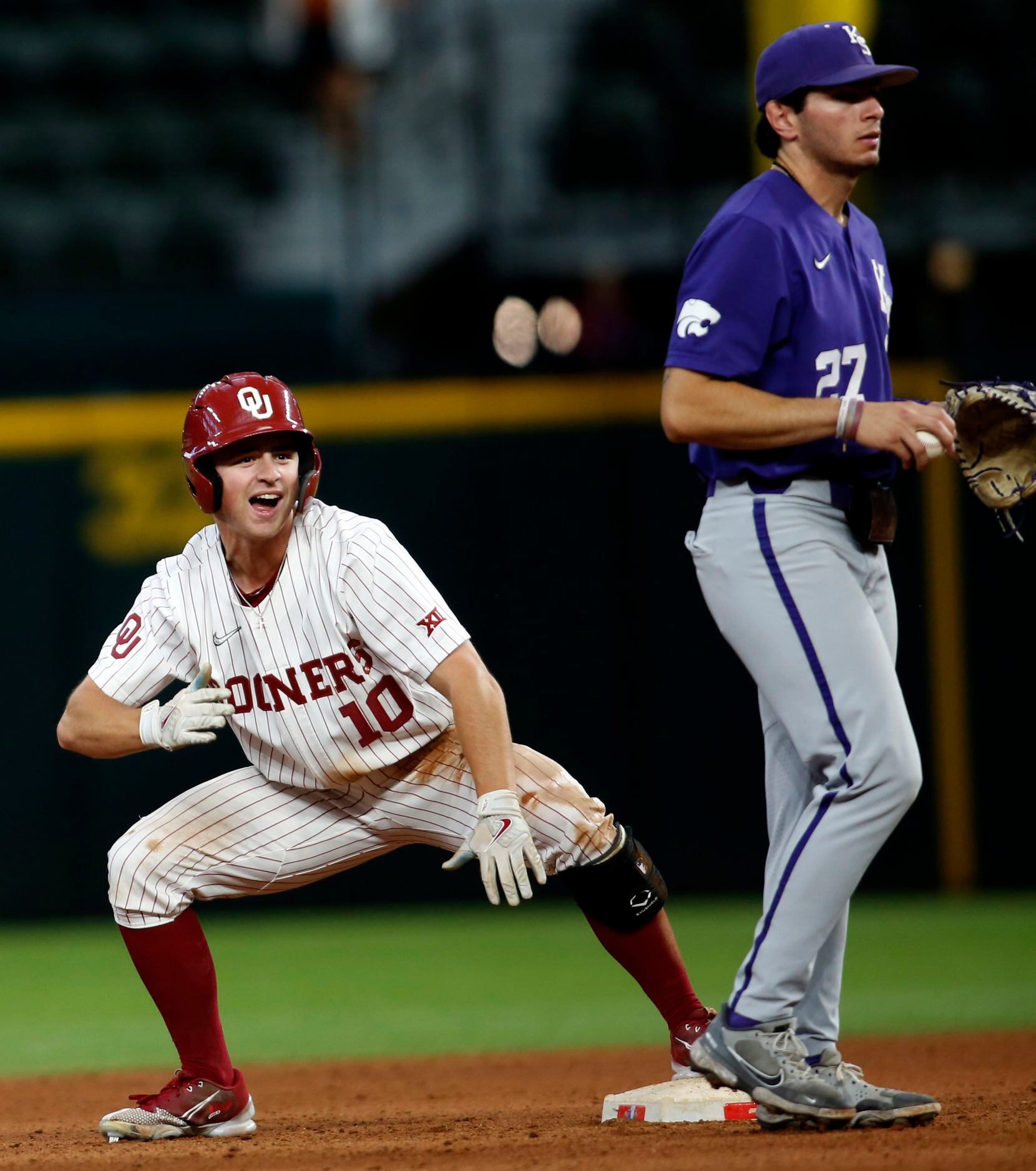 Oklahoma Sooners outfielder Tanner Tredaway (10) gestures to the team dugout as he...