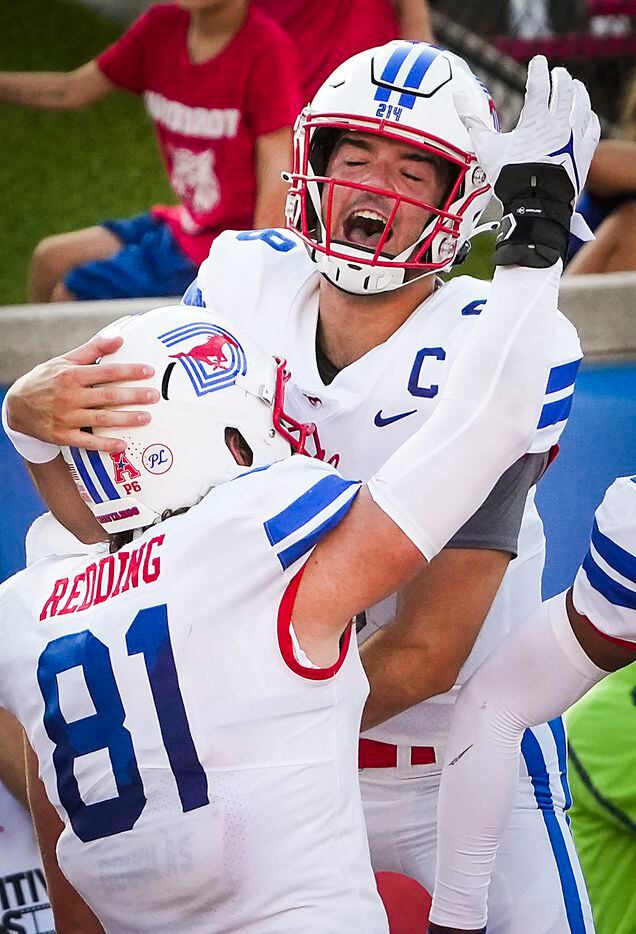 SMU quarterback Tanner Mordecai (8) celebrates with tight end Ben Redding (81) after they...
