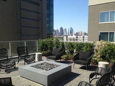 A fire pit at the Ardan tower comes with a view of the Dallas skyline.