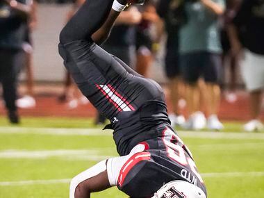 Rockwall-Heath running back  Zach Evans (26) tumbles into the end zone to score the...